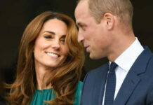 Man and woman smiling and talking facing each other