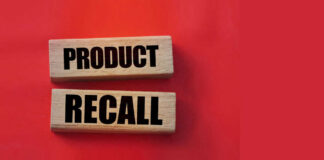 Product recall text on wooden blocks red background
