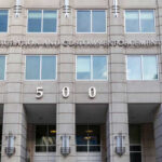 US Immigration and Customs Enforcement building entrance flags