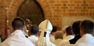 Clergy walking in a church procession from behind