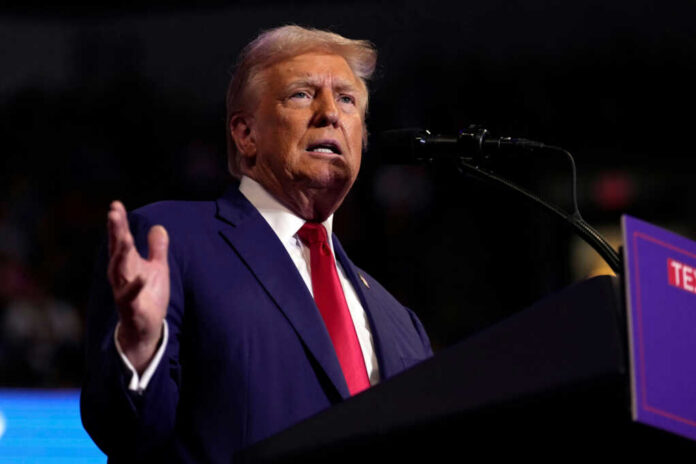Man speaking at a podium with microphone