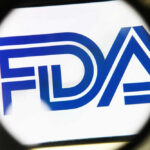 FDA logo under a magnifying glass.