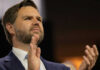Vance’s Path to 2028: Unstoppable or Illusion? Person clapping enthusiastically in formal attire