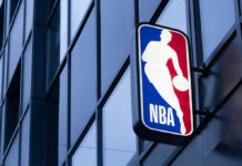 Massive Backlash: NBA Player’s Career ENDING Fast NBA logo on modern building facade
