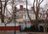 Gracie Mansion Controversy: Mayor’s Credibility at Risk Historic mansion surrounded by bare trees and a fence