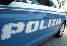 Close-up of a blue police car with the word 'POLIZIA' displayed
