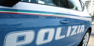 Close-up of a blue police car with the word 'POLIZIA' displayed
