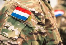 Cuba Relief or Risk? Russian Tankers Approach Close-up of a military uniform with a national flag patch