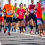 A group of runners participating in a marathon on a sunny day