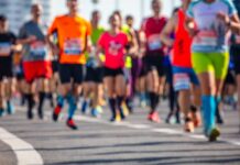 A group of runners participating in a marathon on a sunny day
