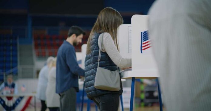 A person casting their vote at a polling station