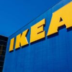 IKEA store exterior with large yellow signage against a blue background