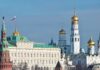 View of the Kremlin with golden domes and the Russian flag