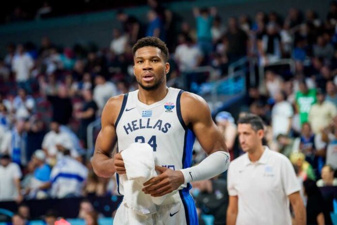 shutterstock_2675506731.jpg Basketball player in a team jersey walking off the court