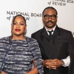 A couple posing at a red carpet event for the National Board of Review