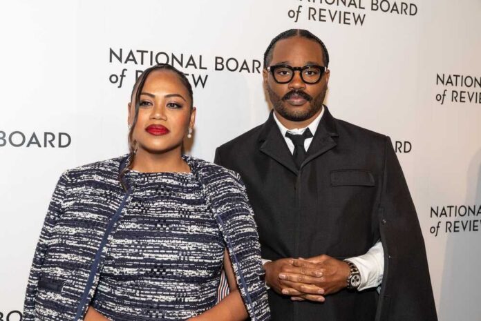 A couple posing at a red carpet event for the National Board of Review