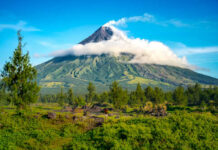 Mayon Volcano’s Eruption: Terrifying Reality Check A majestic volcano surrounded by lush greenery and clouds