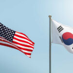 Flags of the United States and South Korea waving in the wind