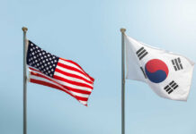 Flags of the United States and South Korea waving in the wind
