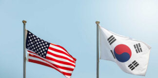 Flags of the United States and South Korea waving in the wind