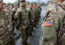 Military personnel standing in formation outdoors