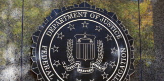 FBI seal against marbled wall background.