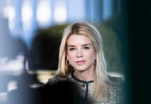 Bondi’s Firing Won’t Dodge Epstein Subpoena Woman with long blonde hair wearing hoop earrings