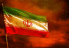 Iranian flag waving against a dramatic orange sky