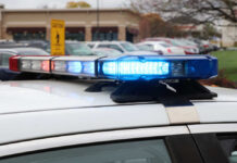 Abduction Nightmare: Omaha Walmart Horror Close-up of a police car's emergency lights in a parking lot