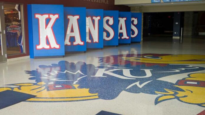 Kansas logo displayed on the floor of a sports venue