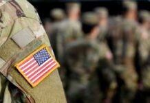 Close-up of a soldier's uniform with an American flag patch