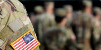 Close-up of a soldier's uniform with an American flag patch