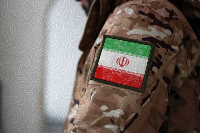 Close-up of a military uniform with an Iranian flag patch