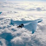 Three drones flying above the clouds in a clear sky