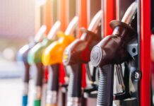 Indiana’s Gas Tax Suspension: Relief or Revenue Risk? Colorful fuel nozzles at a gas station