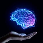 A digital representation of a brain hovering above an open hand