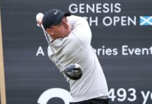 Professional golfer swinging a club at the Genesis Scottish Open