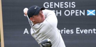 Professional golfer swinging a club at the Genesis Scottish Open
