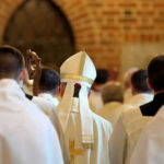 Stunning Move: German Synod Backs Radical Changes Clerics in white robes facing altar in church