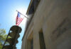 Prosecutors FLEE as DOJ Takes Heat on Comey United States flag Department of Justice building exterior
