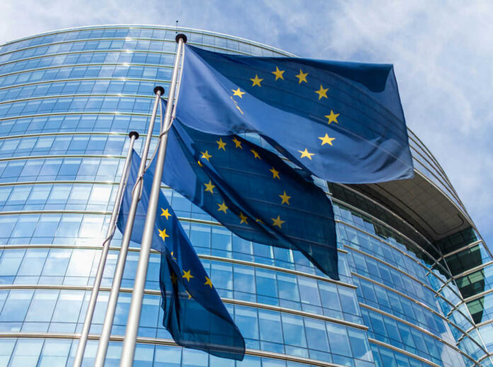 european-union35711349jpg European Union flags outside modern glass building
