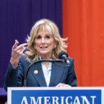 Jill’s Account Rekindles Biden Health Doubts Woman speaking at a podium with microphone