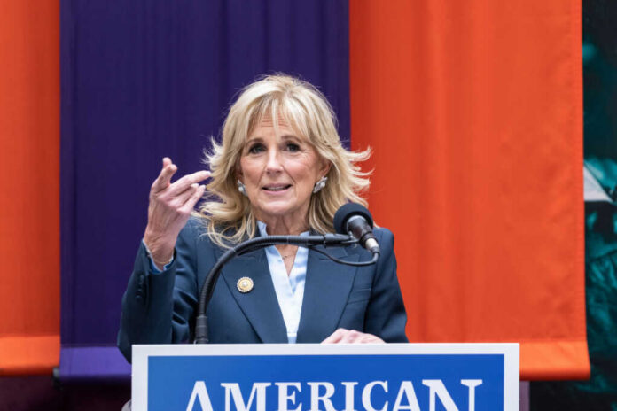 Woman speaking at a podium with microphone
