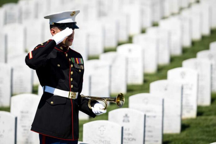 A,Poignant,Moment,Unfolds,As,A,Marine,Plays,Taps,,Honoring A soldier in uniform saluting in a military cemetery with white gravestones in the background
