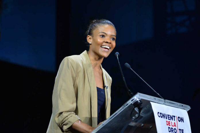 A woman speaking at a podium during a conference