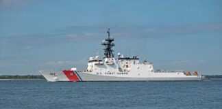 A U.S. Coast Guard patrol vessel sailing on calm waters