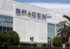 SpaceX IPO Rumors Ignite Stock Frenzy Exterior view of the SpaceX headquarters building with a speed limit sign