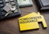 Homeowners insurance document with keys and calculator