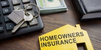 Homeowners insurance document with keys and calculator