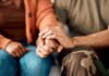 A couple holding hands, showcasing intimacy and support